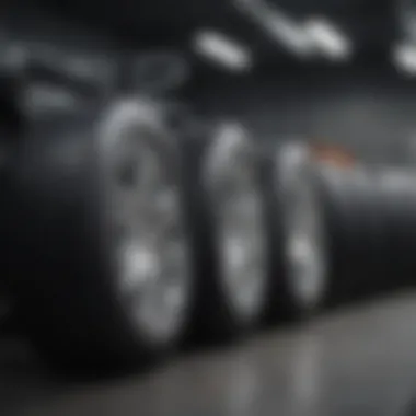 Showcase of various summer tire brands lined up on a showroom floor