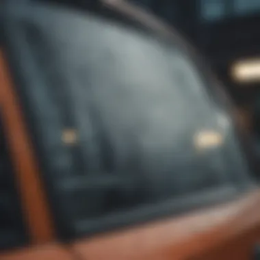 A close-up view of a car window fogged up due to humidity.