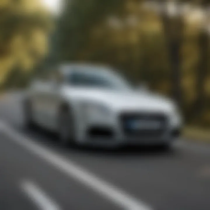 2012 Audi TT Quattro driving on a winding road, emphasizing agility and handling