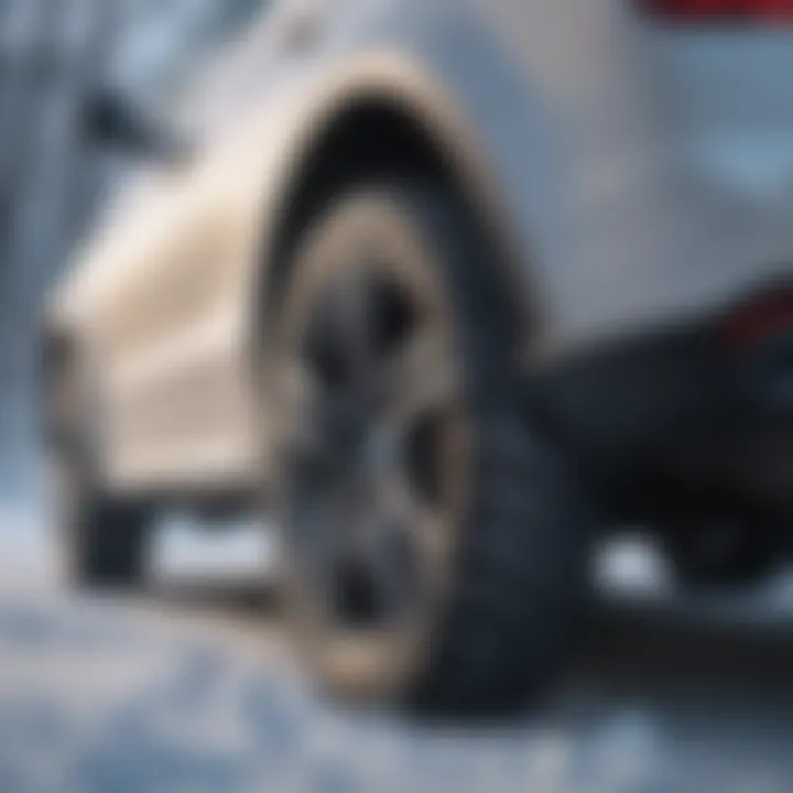 Installation of snow chains on a vehicle in snowy conditions