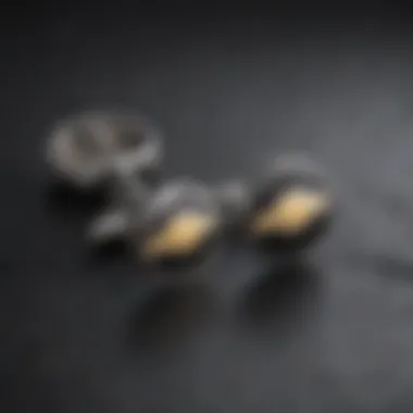 Close-up of intricately designed Chevy cufflinks resting on a black suit