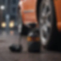 A compact air inflator for car tires placed next to a vehicle.