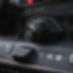 Detailed view of an AUX input adapter connected to a car stereo.