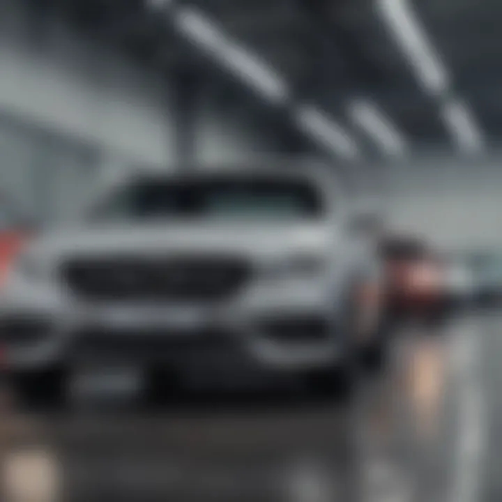 An array of affordable cars parked in a dealership lot.