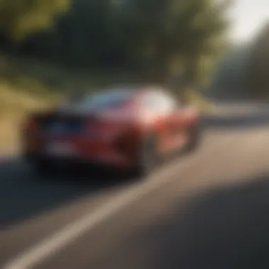 Dynamic action shot of a coupe car navigating a winding road.