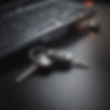 A close-up of a car key next to a computer, symbolizing the intersection of technology and automotive sales.