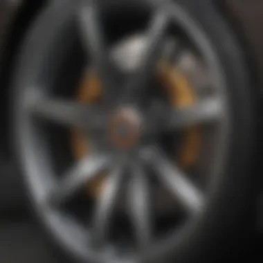 Close-up of a 4-door sports car's sporty wheel and brake system