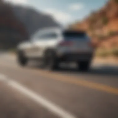 A sleek SUV cruising on a scenic highway