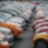 An array of used cars under one thousand dollars lined up in a parking lot