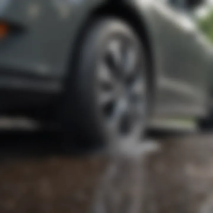 Sedan driving on a wet road showcasing tire grip and safety