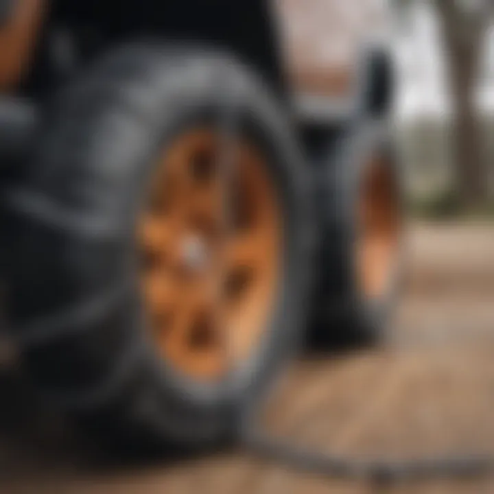 A variety of off-road tire chains displayed on a wooden surface indicating different types.