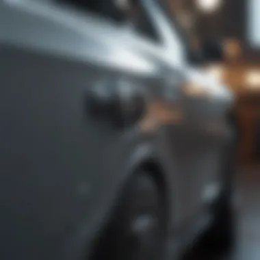 Close-up of a dent being repaired with a suction cup tool.